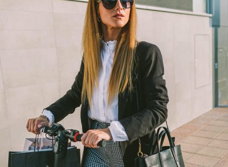woman-with-shopping-bags-on-electric-scooter.jpg